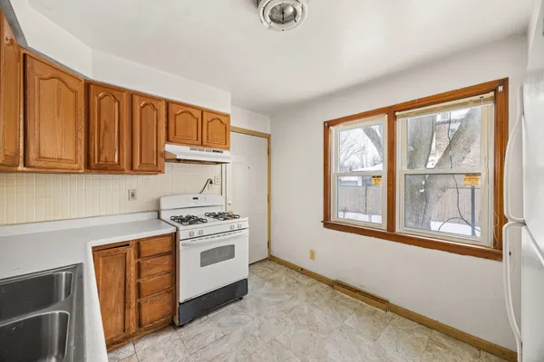 a kitchen with a stove a sink and a microwave