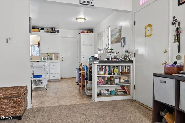 a room with lot of cabinet and a chair