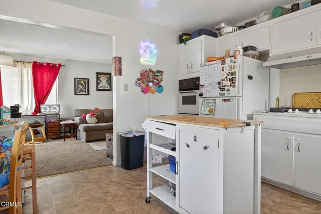 a view of kitchen with furniture and window