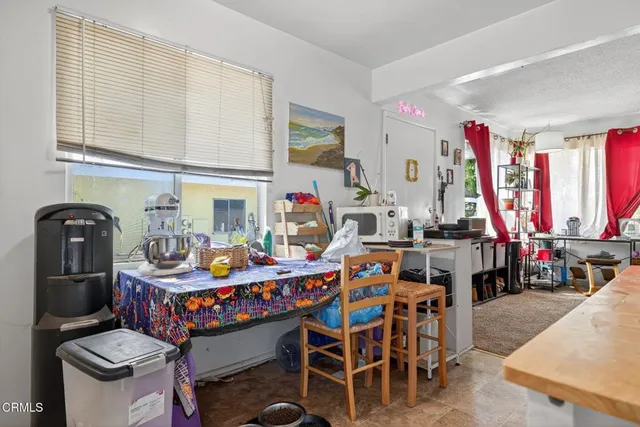 a view of a dining room with furniture window and outside view