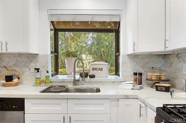 a kitchen with a sink and a window
