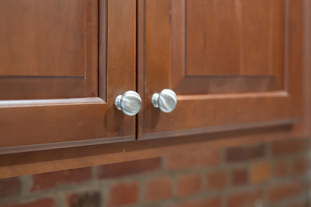 72 River Street, Unit 6 Haverhill, MA 01832 - Photo 19 of 40 a close view of racks on a wall