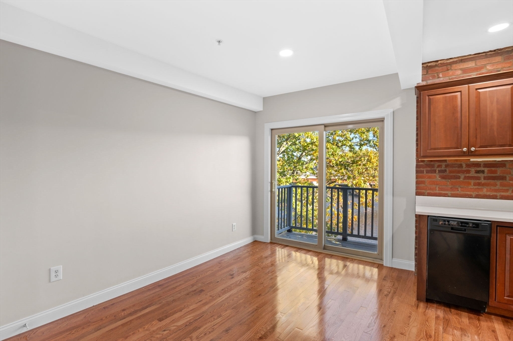 72 River Street, Unit 6 Haverhill, MA 01832 - Photo 22 of 40 a view of a room with wooden floor and a window
