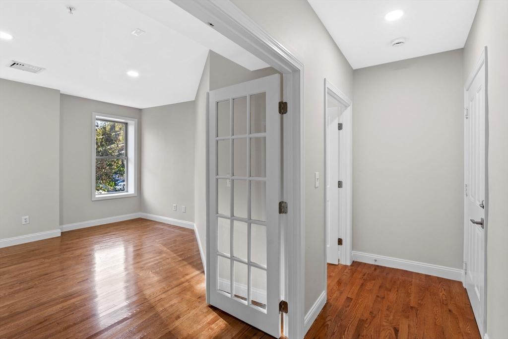 72 River Street, Unit 6 Haverhill, MA 01832 - Photo 29 of 40 a view of entryway with wooden floor
