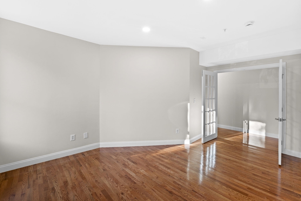 72 River Street, Unit 6 Haverhill, MA 01832 - Photo 34 of 40 a view of empty room with wooden floor