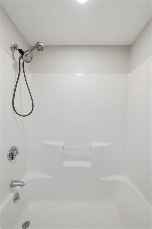 72 River Street, Unit 6 Haverhill, MA 01832 - Photo 40 of 40 a bathroom with a bath tub with a shower