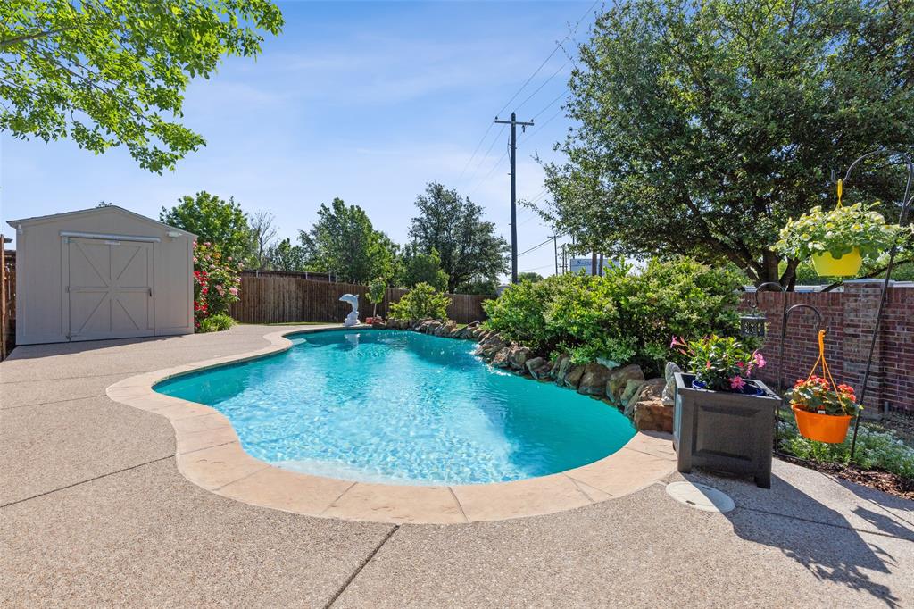 a view of a swimming pool with an outdoor seating