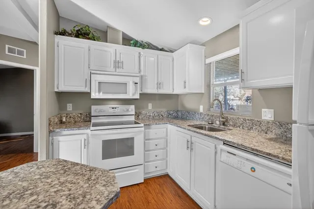 an aerial view of a city with lots of residential buildings
