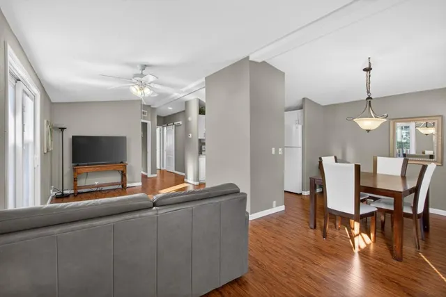 a view of a dining room with furniture window and wooden floor