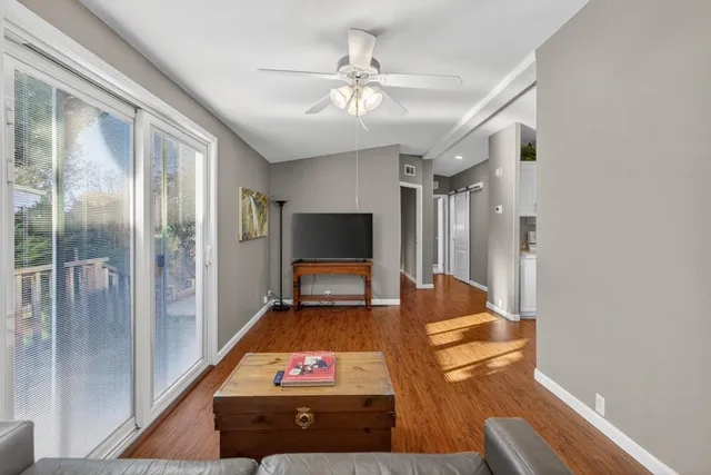 a kitchen with white cabinets and a stove