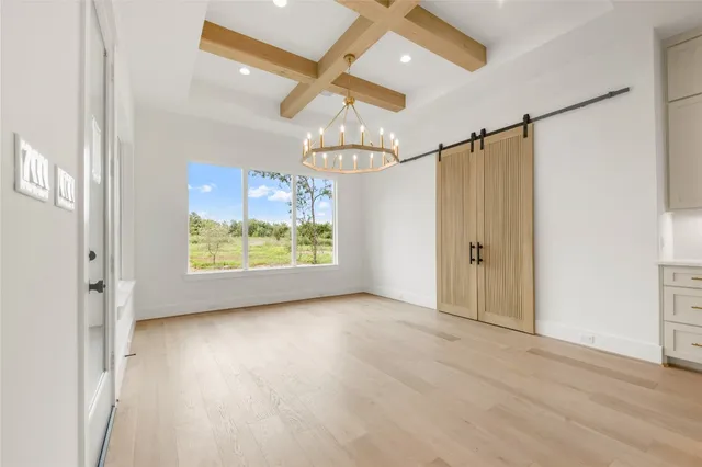 a spacious bathroom with a double vanity sink mirror and a bathtub