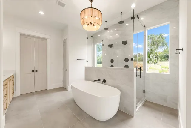 an empty room with closet and windows