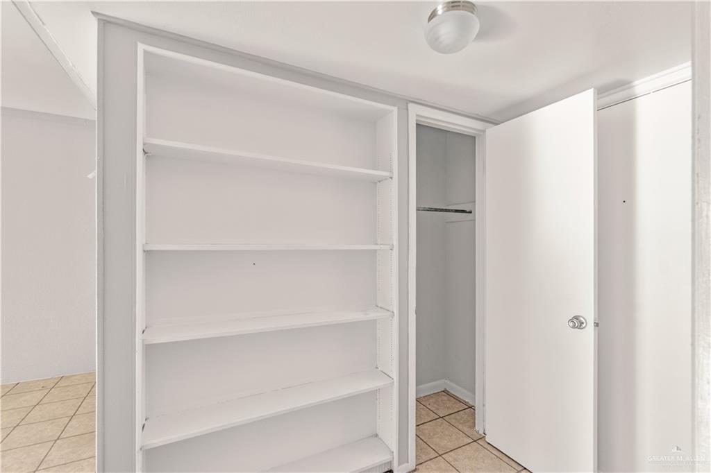 121 North Montevideo Avenue Edinburg, TX 78541 - Photo 6 of 8 a view of walk in closet with empty racks