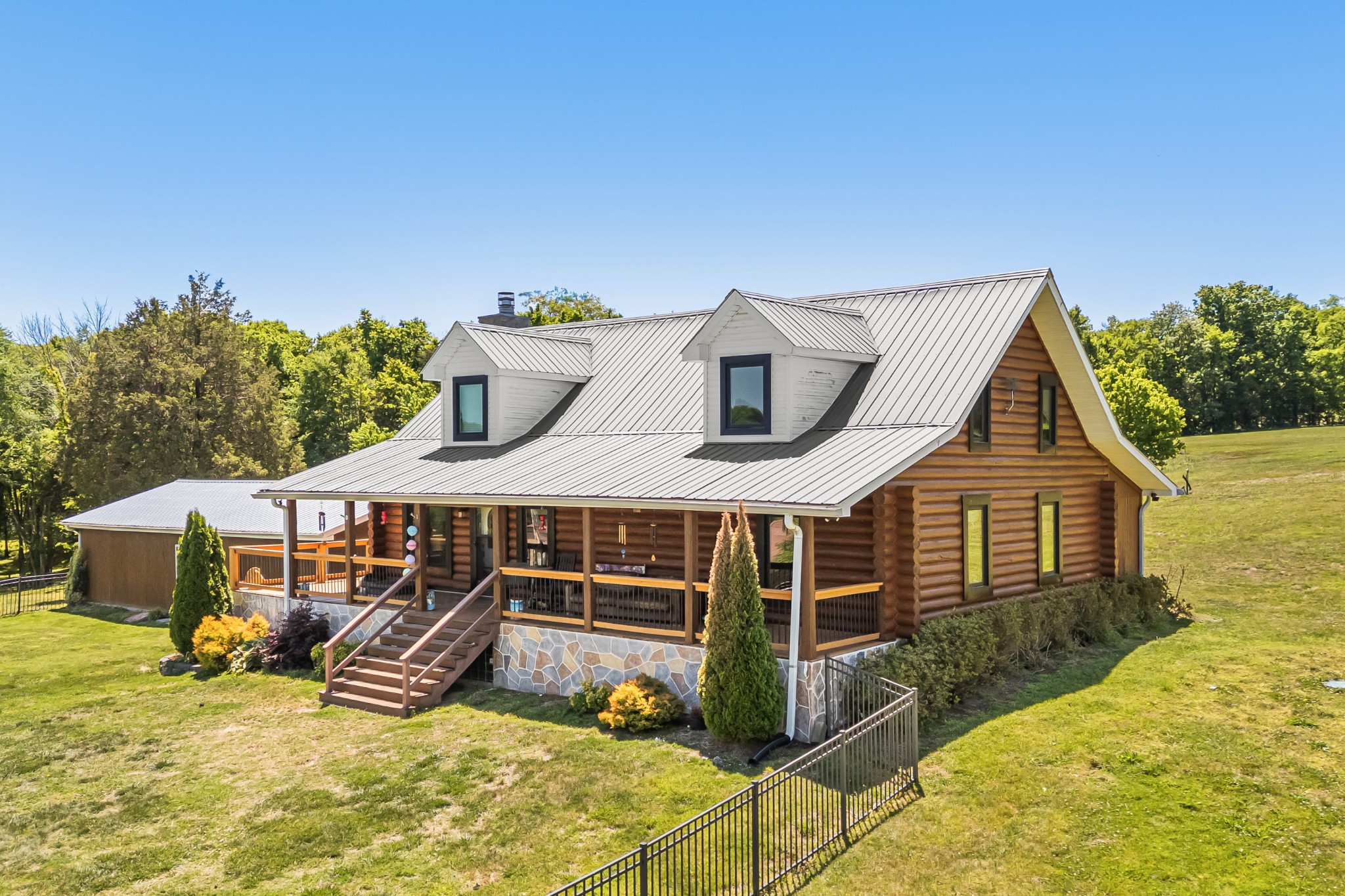 642 Beach Bottom Road Watertown, TN 37184 - Photo 2 of 48 a view of a house with a big yard and potted plants