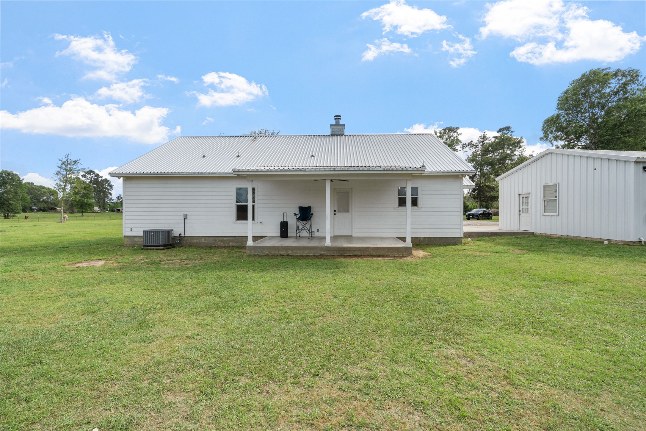 1121 Pelican Road Shepherd, TX 77371 - Photo 25 of 34 Backview of FarmHouse & Covered Porch