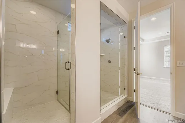 an empty room with a window and a ceiling fan