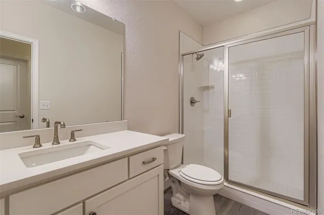 a kitchen with a sink and a refrigerator