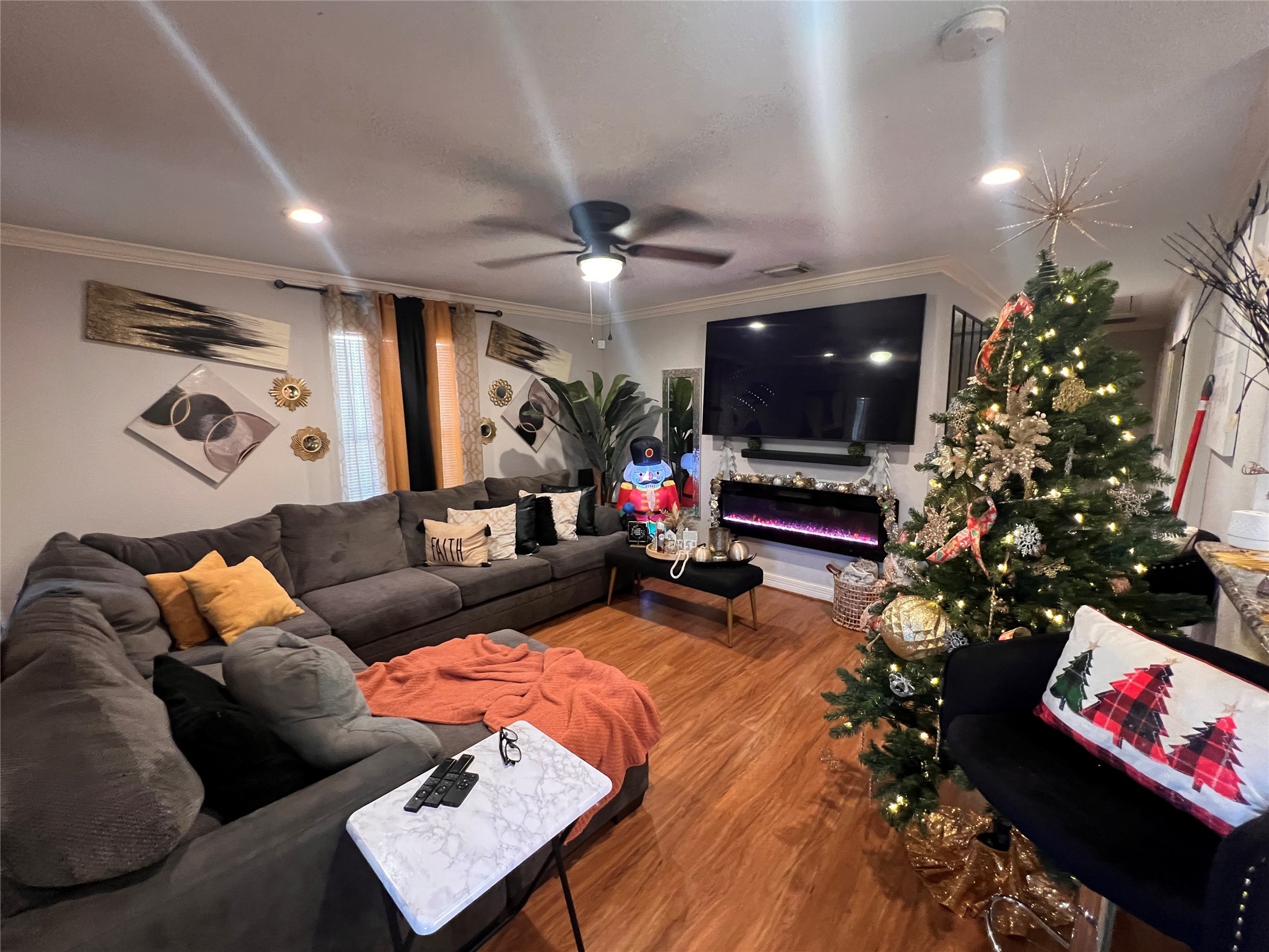 110 Gans Street Houston, TX 77029 - Photo 3 of 17 a living room with furniture and a flat screen tv