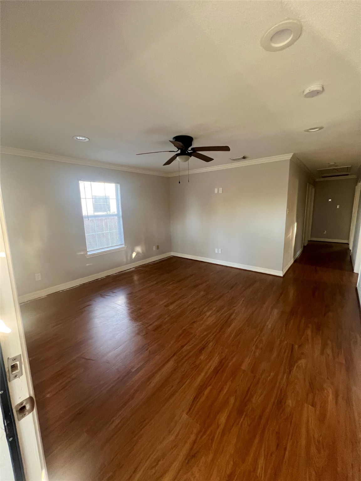 110 Gans Street Houston, TX 77029 - Photo 5 of 17 an empty room with wooden floor and windows