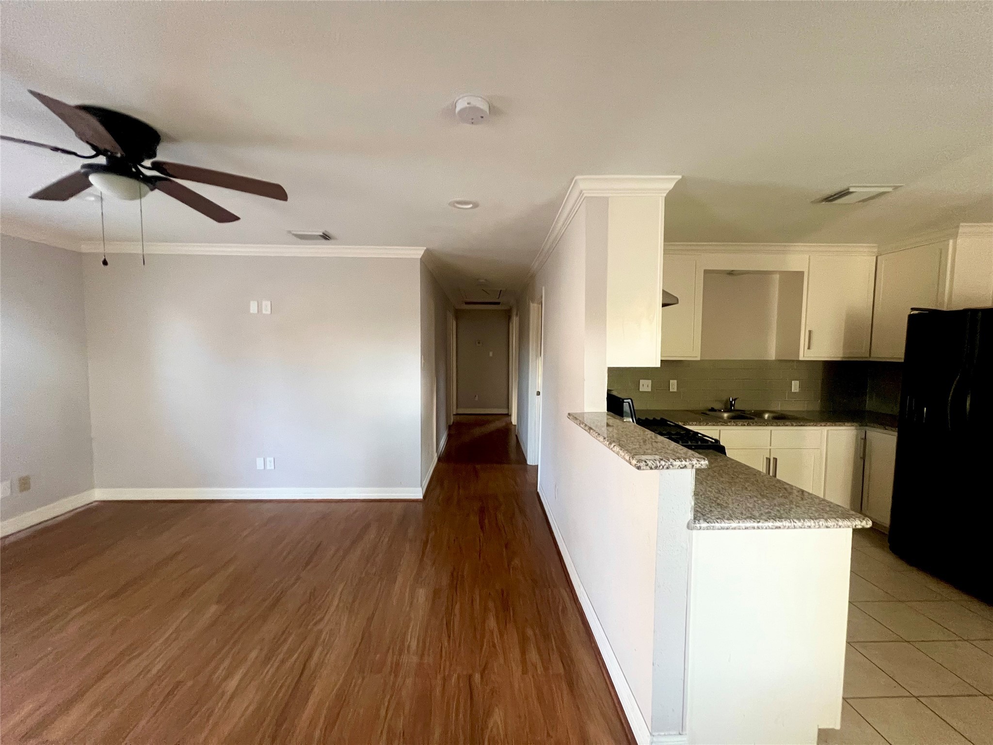 110 Gans Street Houston, TX 77029 - Photo 6 of 17 a view of a kitchen cabinets a sink and wooden floor