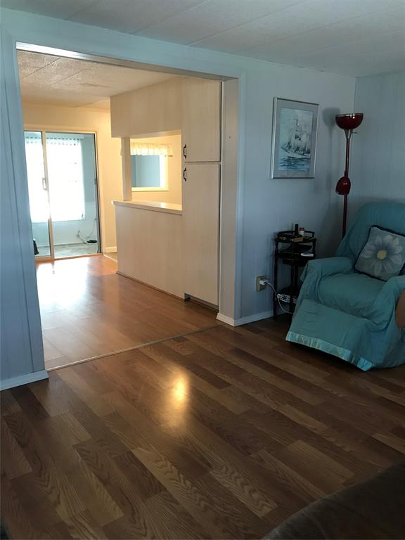 1112 Southeast 21st Street Okeechobee, FL 34974 - Photo 11 of 20 a living room with furniture and a hard wood floor