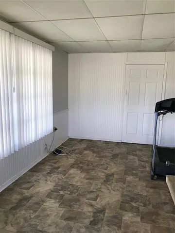 a view of an empty room and window