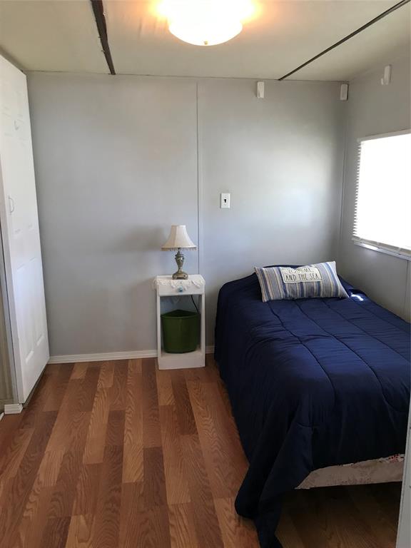 1112 Southeast 21st Street Okeechobee, FL 34974 - Photo 19 of 20 a bedroom with a bed and window