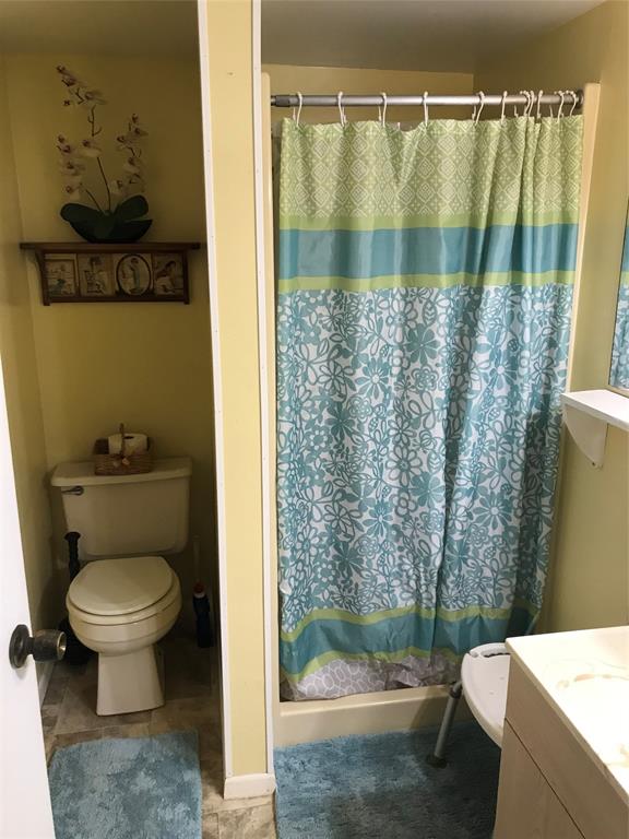 1112 Southeast 21st Street Okeechobee, FL 34974 - Photo 20 of 20 a bathroom with a toilet and a shower