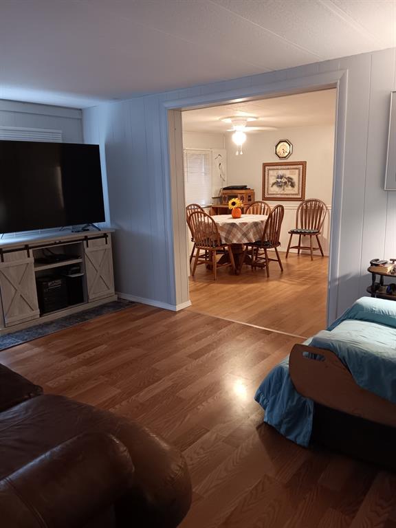 1112 Southeast 21st Street Okeechobee, FL 34974 - Photo 9 of 20 a living room with furniture and a flat screen tv