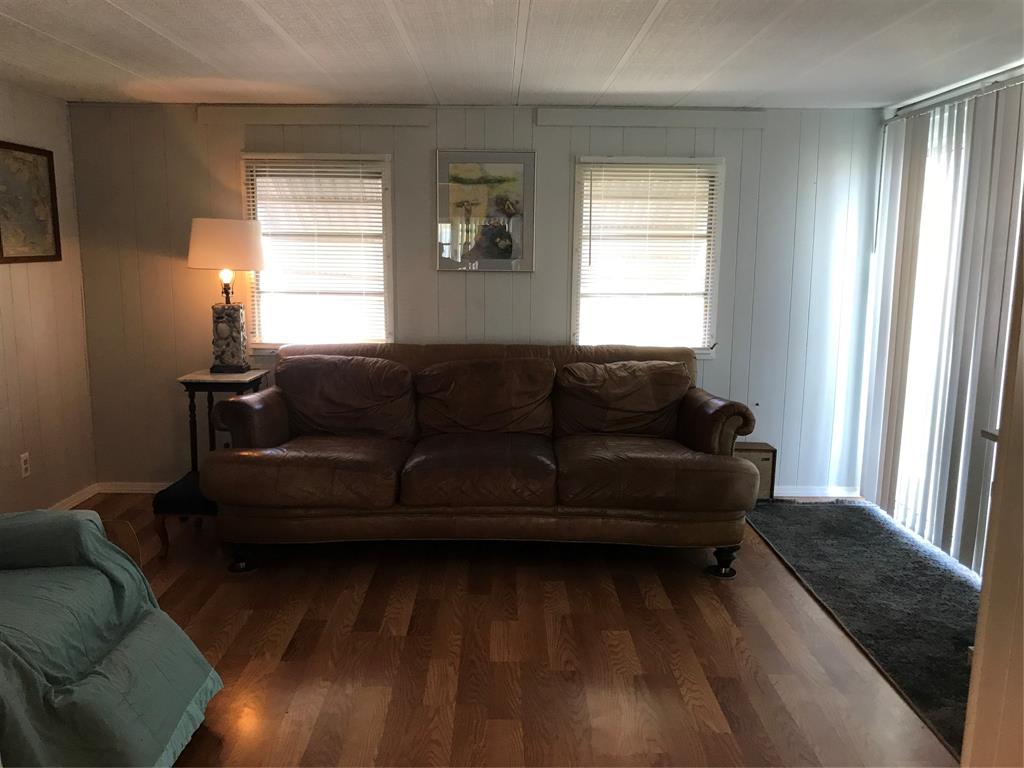 1112 Southeast 21st Street Okeechobee, FL 34974 - Photo 10 of 20 a living room with furniture and a window