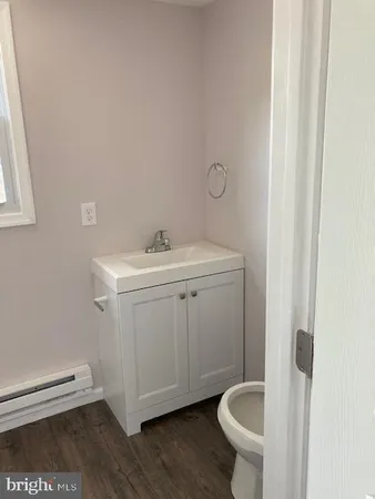 a bathroom with a sink and toilet