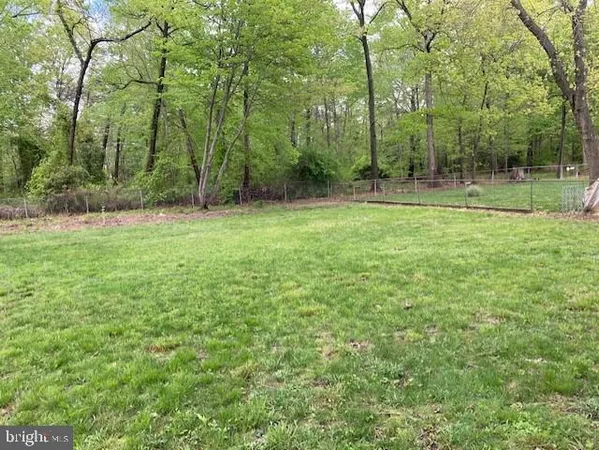 a view of outdoor space with deck and yard
