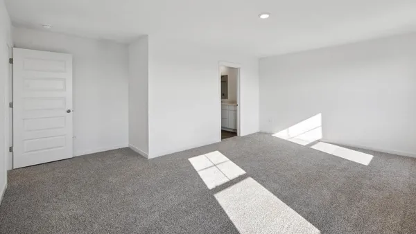 a view of an empty room and window