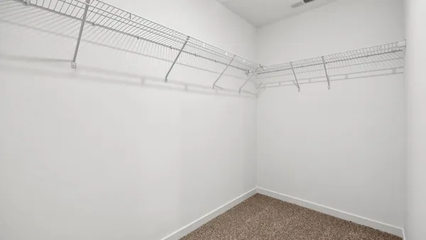 a view of a room with racks on the wall