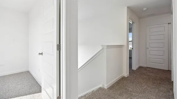 a view of a hallway with closet
