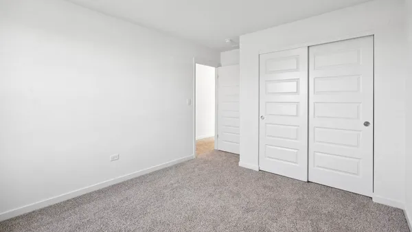 an empty room with closet