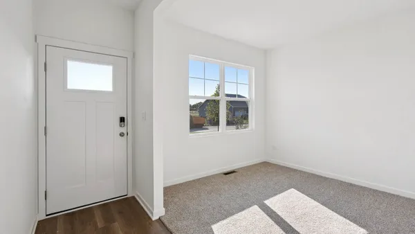 a view of an empty room with a window