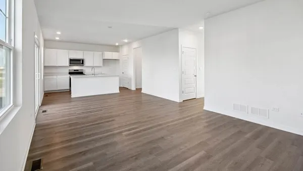 a view of kitchen with wooden floor