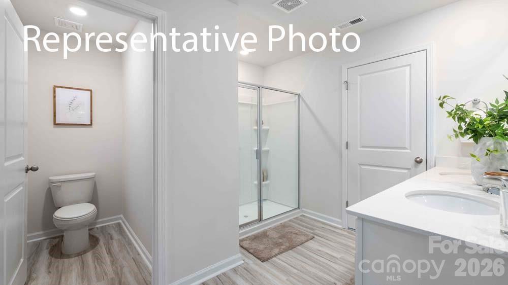 7592 Bainbridge Road Sherrills Ford, NC 28673 - Photo 15 of 28 a bathroom with a sink a toilet and shower