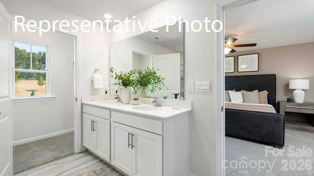 7592 Bainbridge Road Sherrills Ford, NC 28673 - Photo 16 of 28 a bathroom with a sink and a mirror