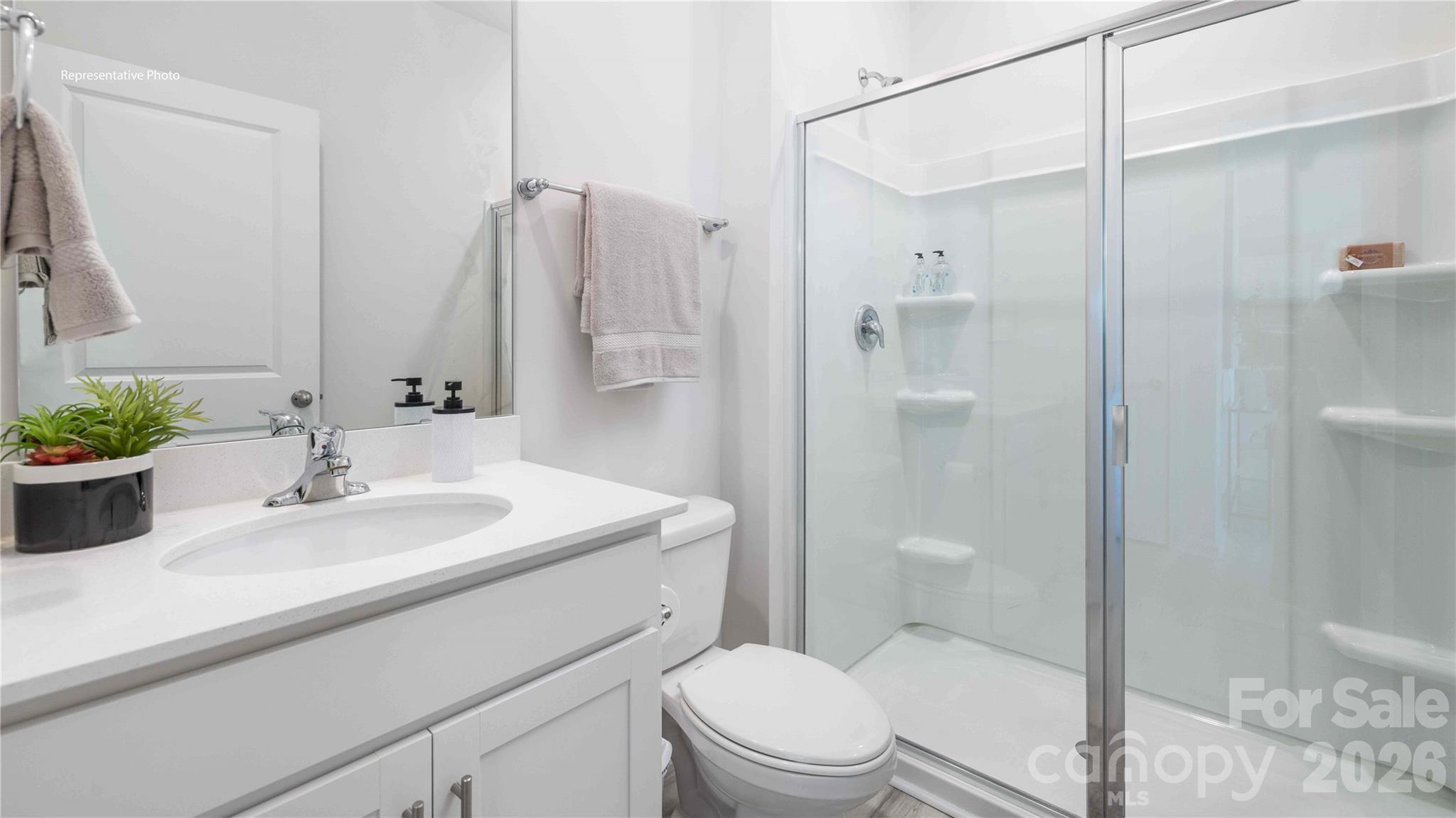 7592 Bainbridge Road Sherrills Ford, NC 28673 - Photo 18 of 28 a bathroom with a sink toilet and shower