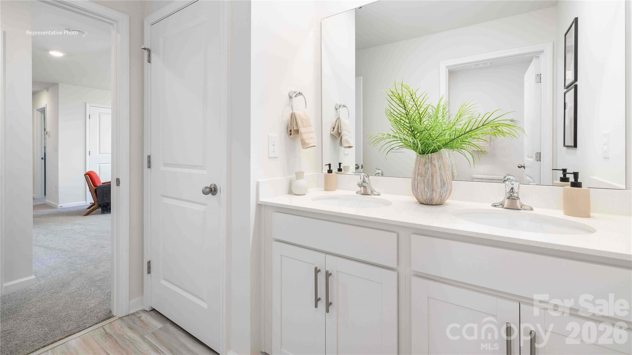 7592 Bainbridge Road Sherrills Ford, NC 28673 - Photo 25 of 28 a bathroom with a sink a vanity and a mirror