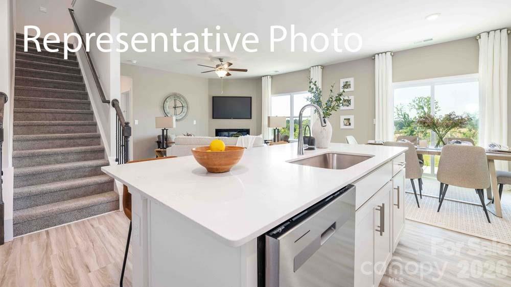 7592 Bainbridge Road Sherrills Ford, NC 28673 - Photo 6 of 28 a kitchen with a table chairs and entryway