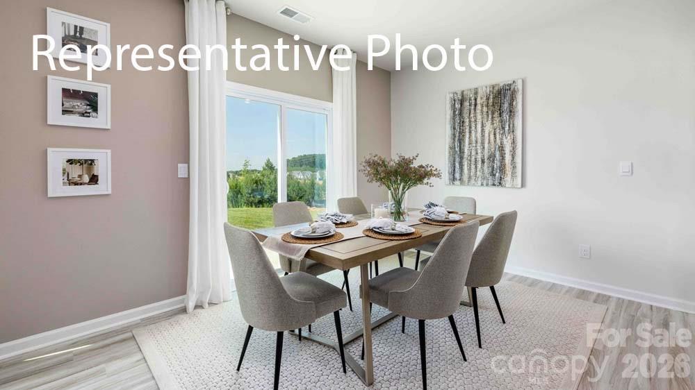 7592 Bainbridge Road Sherrills Ford, NC 28673 - Photo 8 of 28 a view of a dining room that has a table and chairs in it