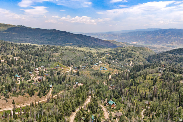1782 Pine Loop Road Coalville, UT 84017 - Photo 49 of 52 Expansive mountainous terrain with varied tree coverage, multiple residential structures, and winding unpaved roads