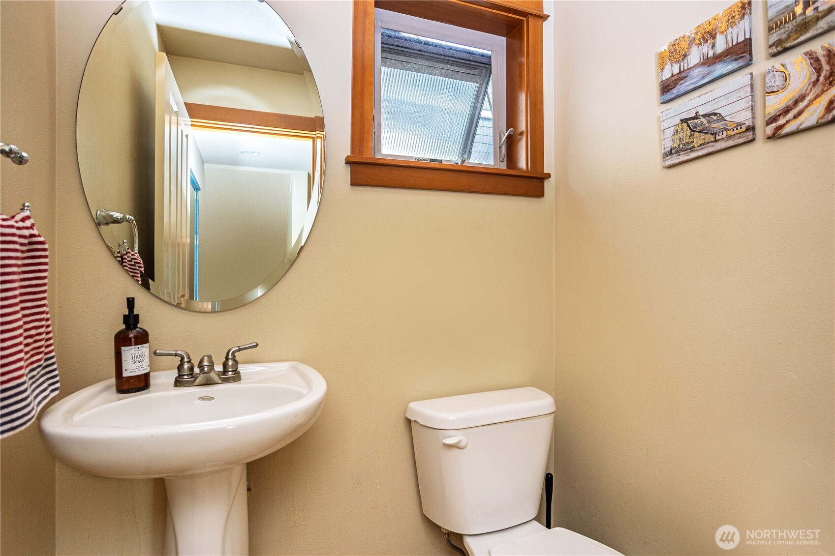 3314 Wetmore Avenue South, Unit B Seattle, WA 98144 - Photo 12 of 28 a bathroom with a toilet sink and mirror