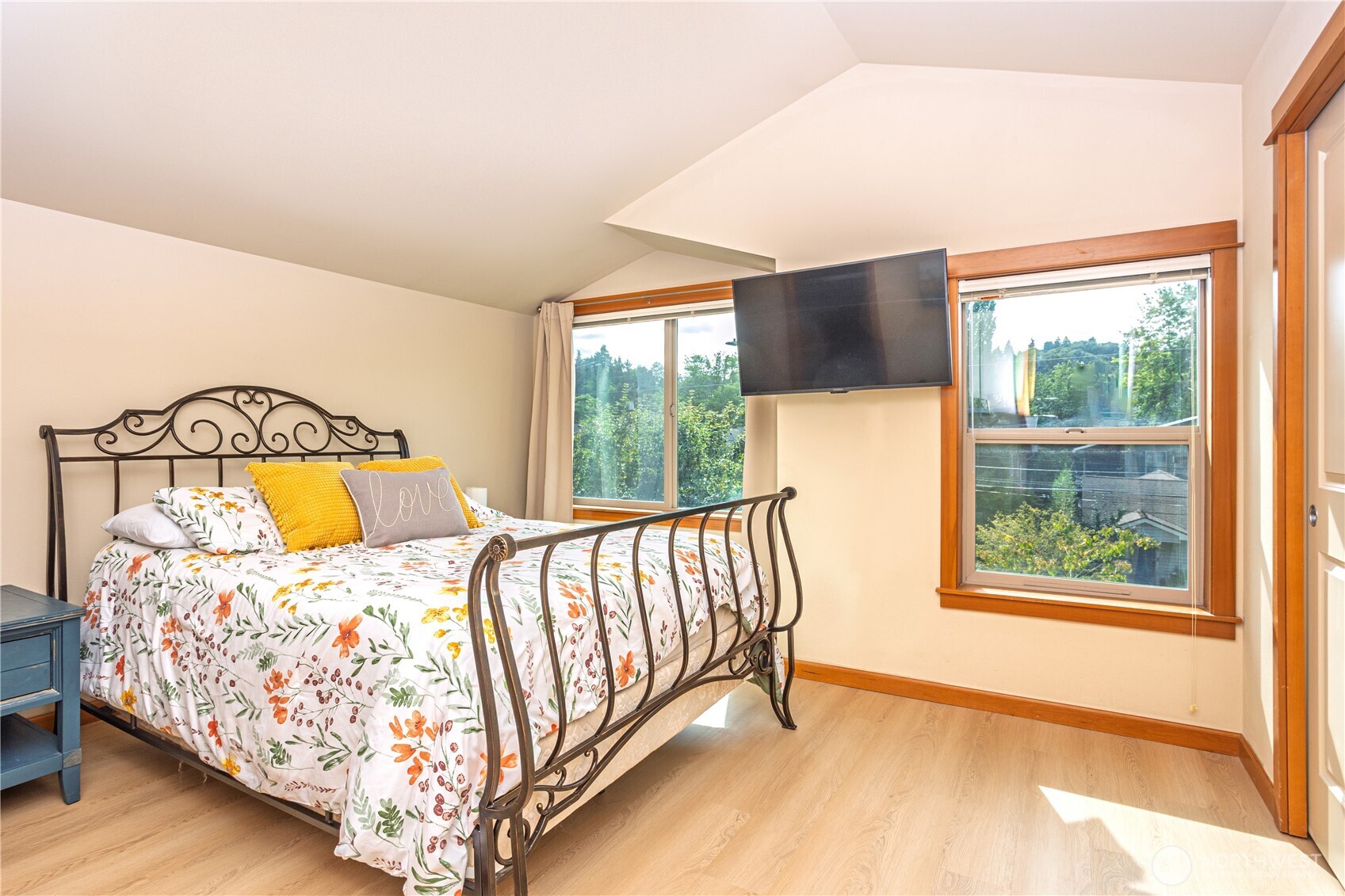 3314 Wetmore Avenue South, Unit B Seattle, WA 98144 - Photo 13 of 28 a bed sitting in a bedroom next to a window