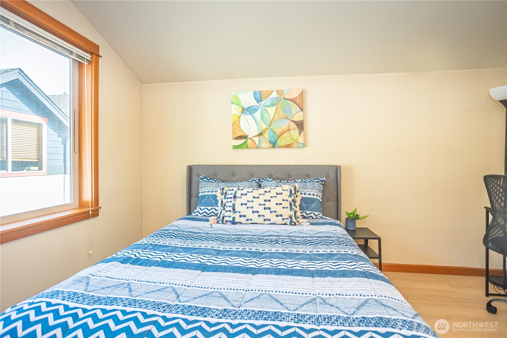 3314 Wetmore Avenue South, Unit B Seattle, WA 98144 - Photo 19 of 28 a bedroom with a bed and a window