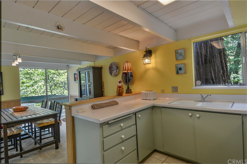 26415 Fernrock Road Twin Peaks, CA 92391 - Photo 11 of 23 a bathroom with a granite countertop sink and a mirror