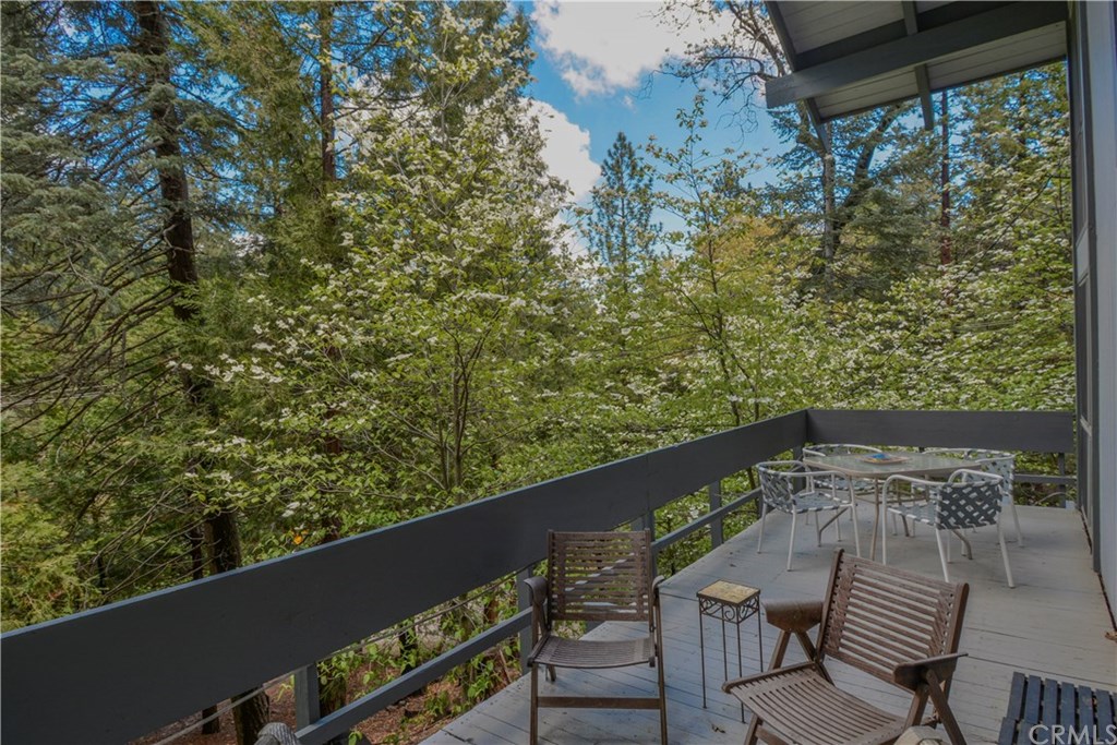 26415 Fernrock Road Twin Peaks, CA 92391 - Photo 7 of 23 a balcony with wooden floor and outdoor seating